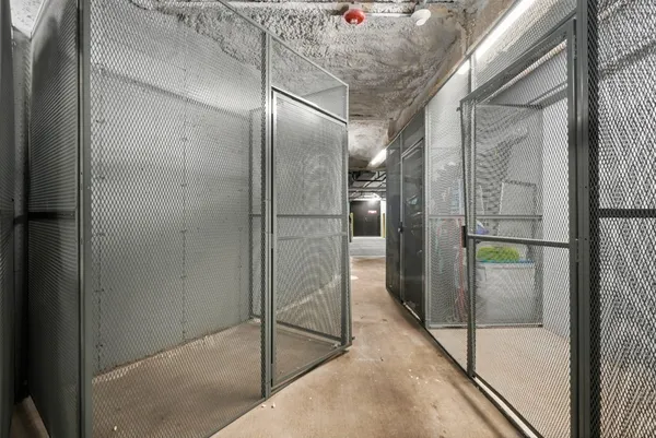 a bathroom with a glass shower door and mirror