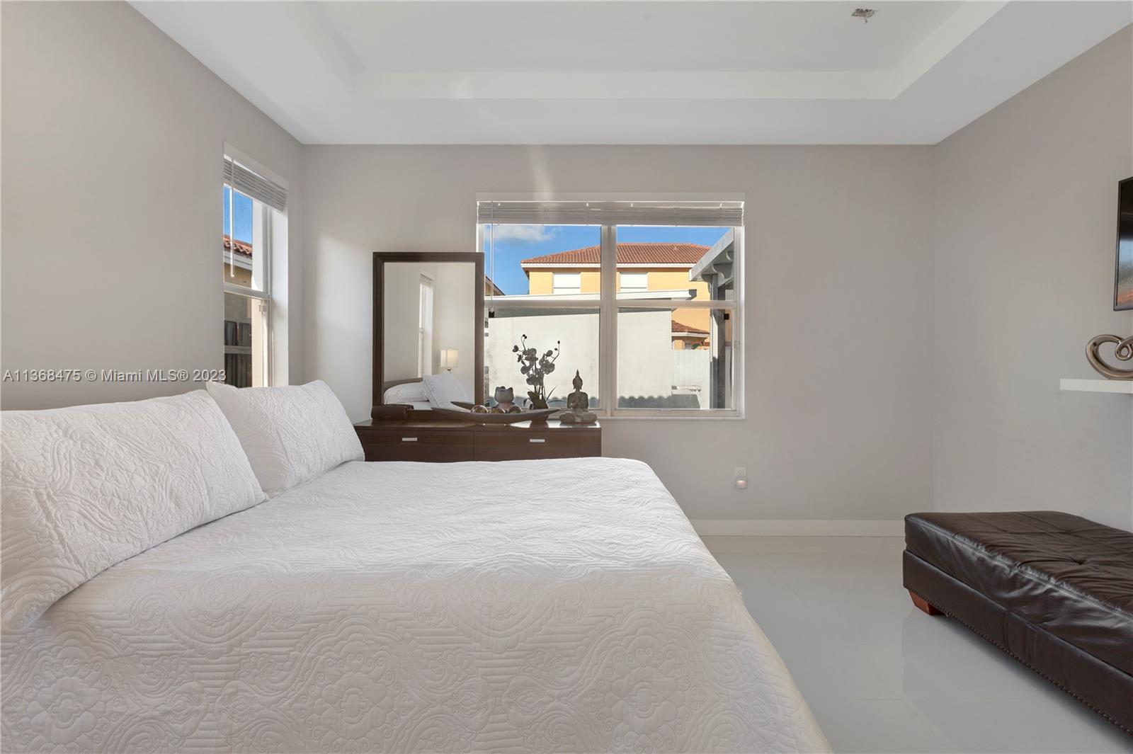 24547 Southwest 109th Avenue Homestead, FL 33032 - Photo 9 of 20 a large bedroom with a bed and window