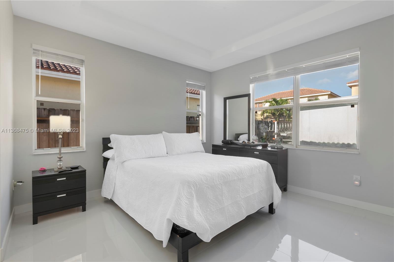 24547 Southwest 109th Avenue Homestead, FL 33032 - Photo 10 of 20 a bedroom with a bed and window
