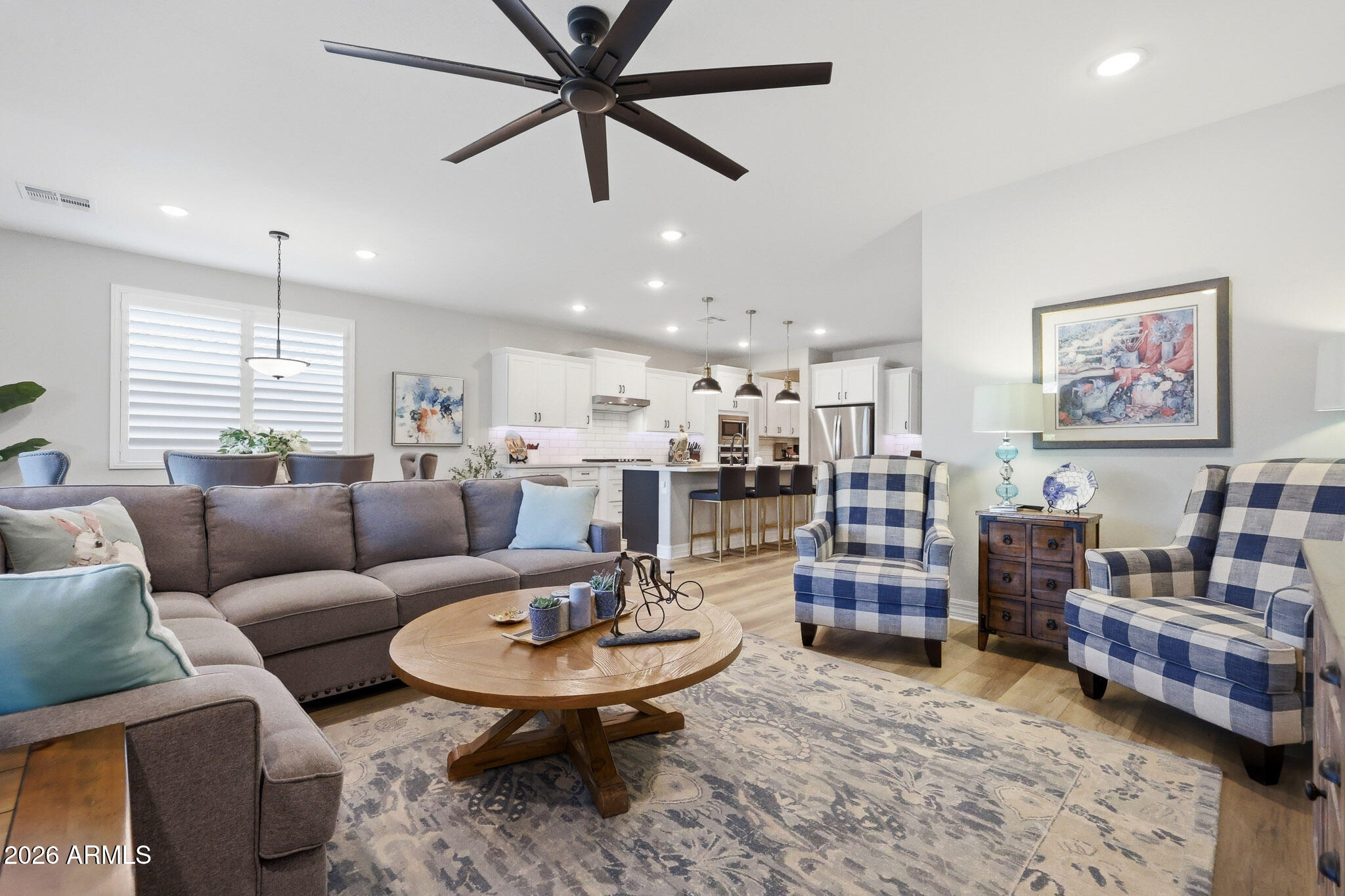 20636 West Luke Avenue Buckeye, AZ 85396 - Photo 11 of 42 a living room with furniture and kitchen view