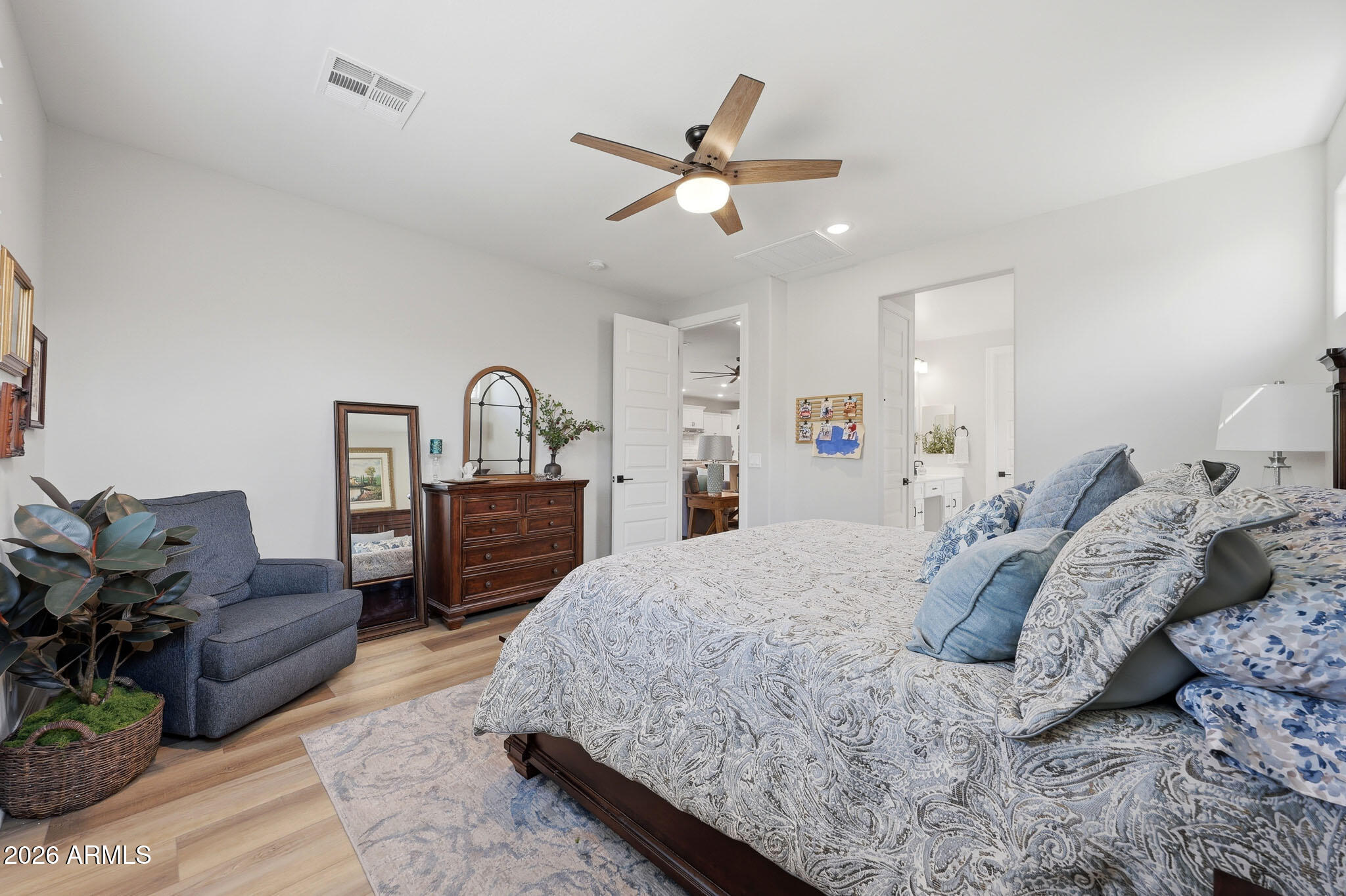 20636 West Luke Avenue Buckeye, AZ 85396 - Photo 13 of 42 a bedroom with a bed furniture and a dresser
