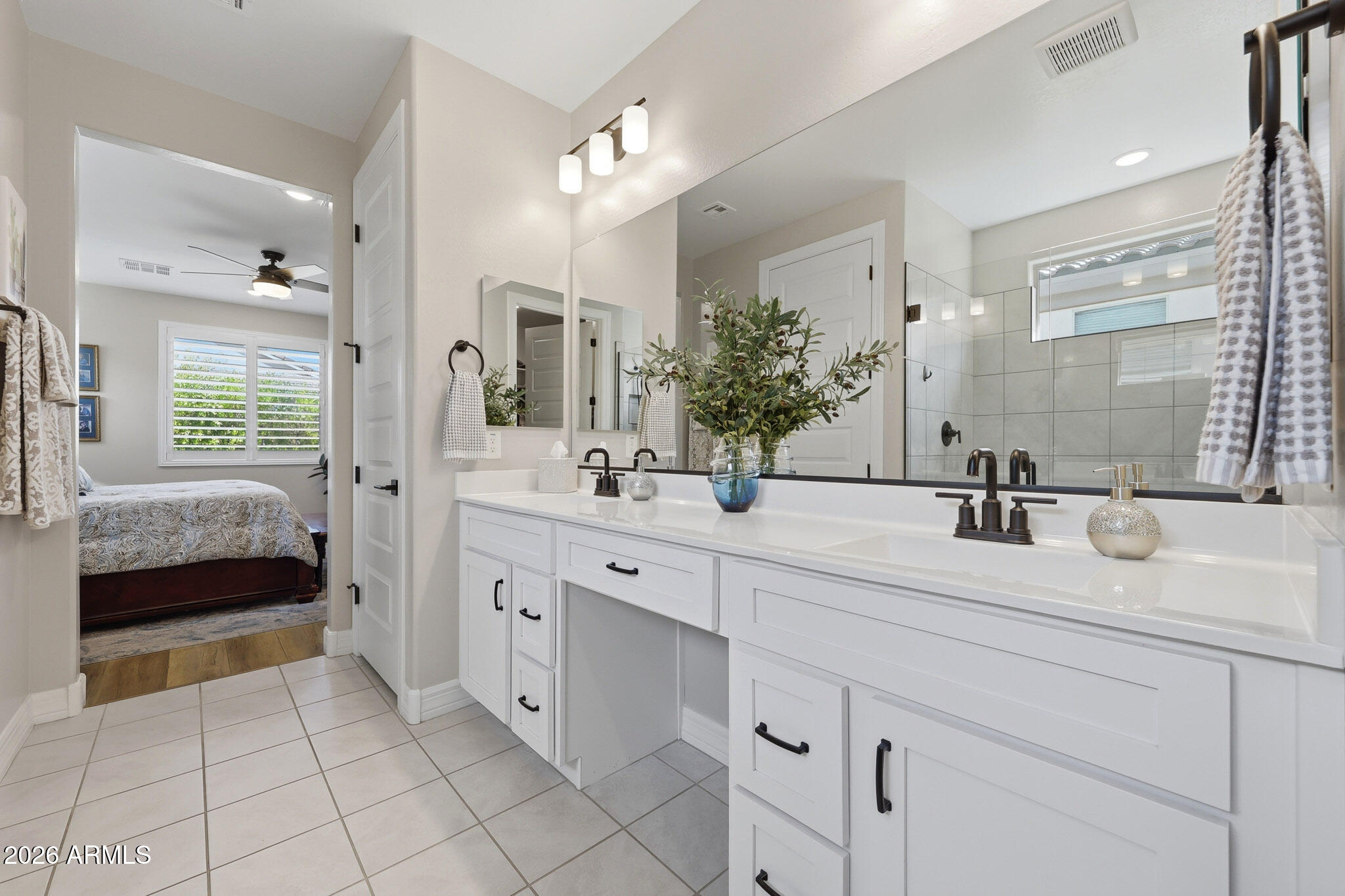 20636 West Luke Avenue Buckeye, AZ 85396 - Photo 14 of 42 a spacious bathroom with a double vanity sink mirror and bathtub