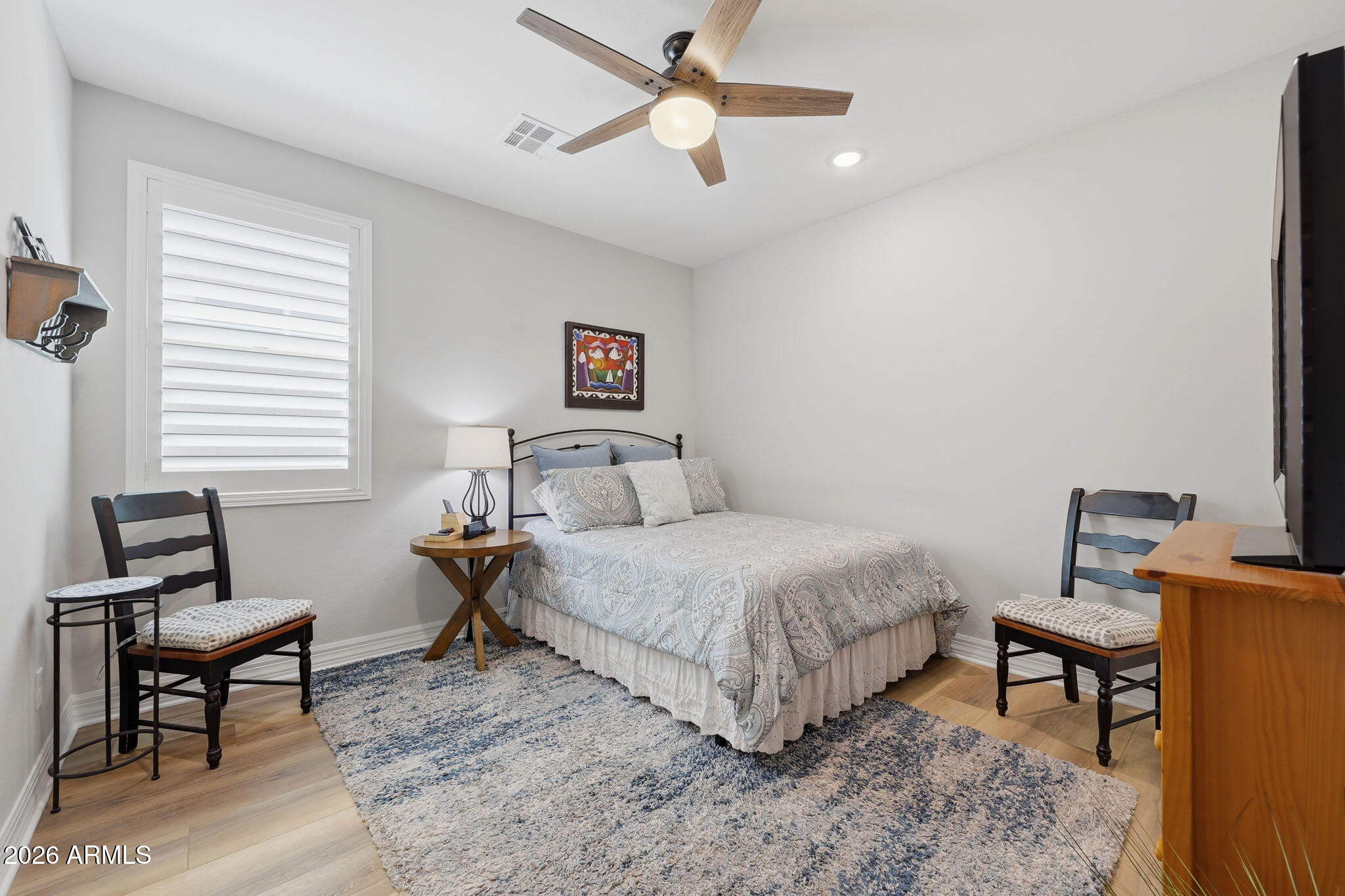 20636 West Luke Avenue Buckeye, AZ 85396 - Photo 17 of 42 a bedroom with a bed window and a desk