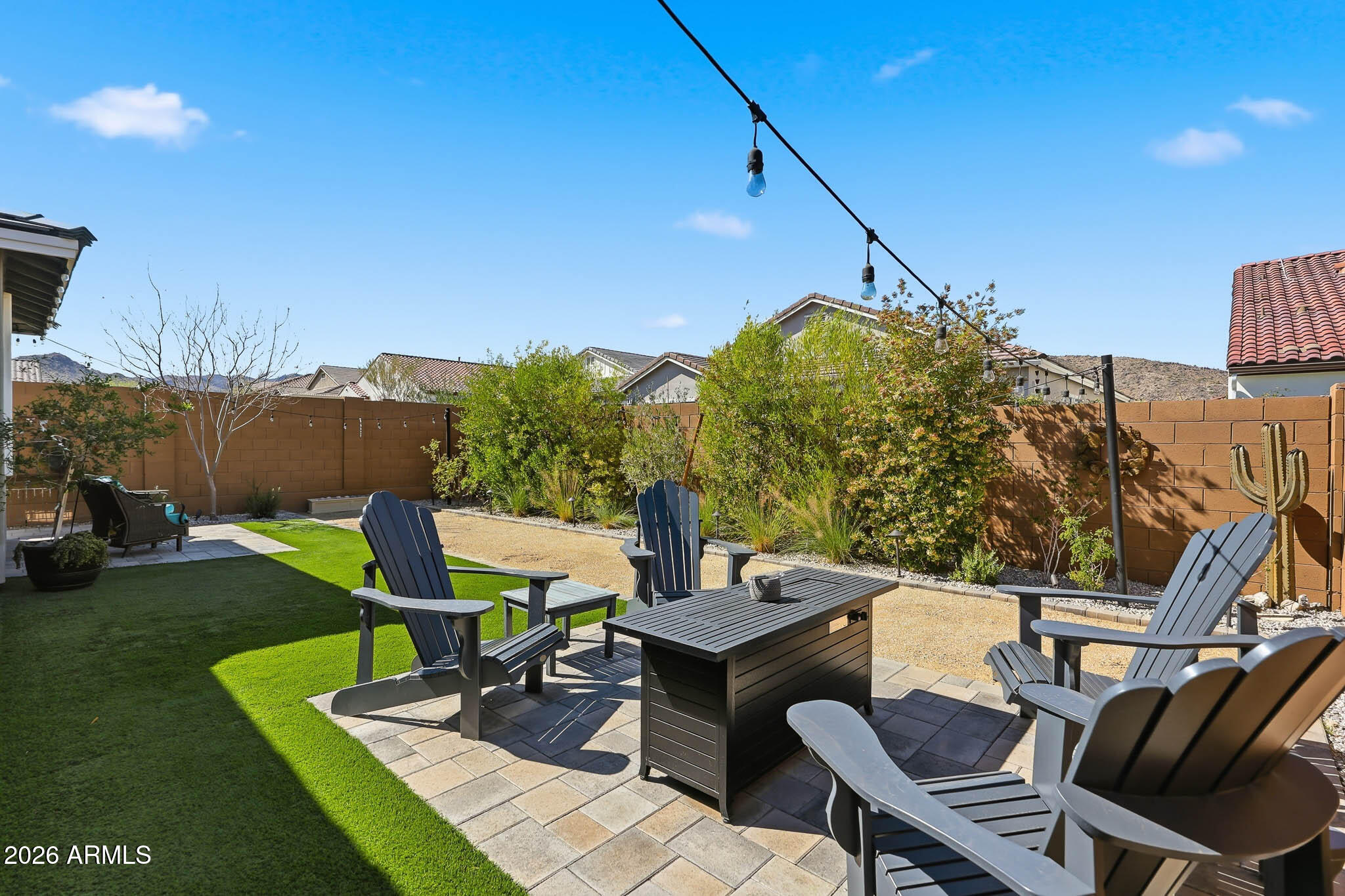 20636 West Luke Avenue Buckeye, AZ 85396 - Photo 23 of 42 a view of a patio with table and chairs and a barbeque