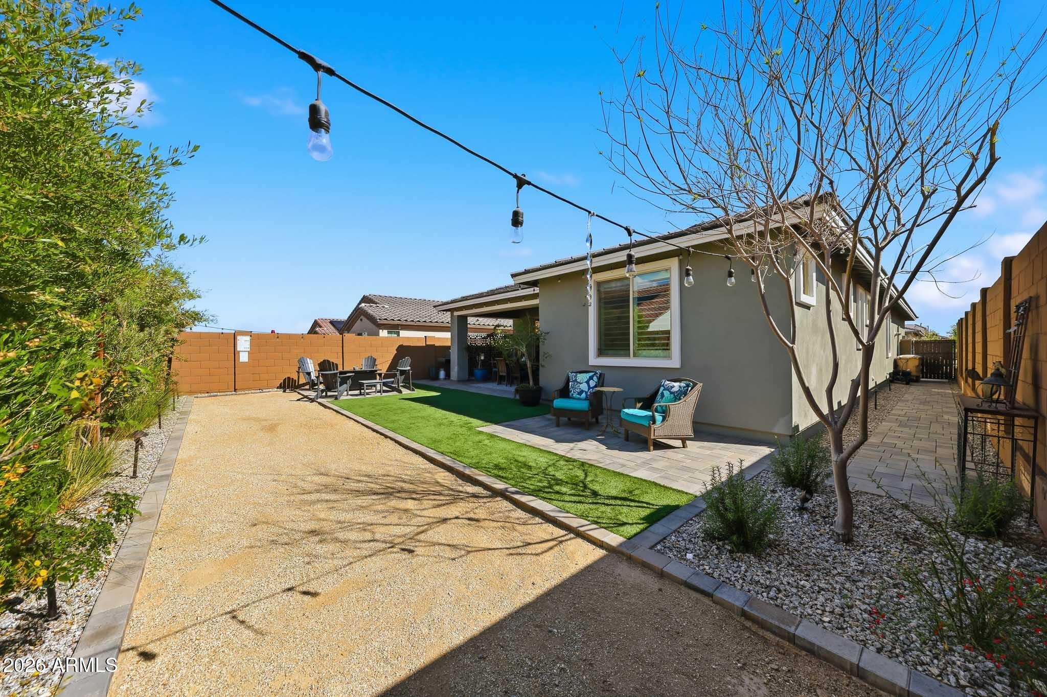 20636 West Luke Avenue Buckeye, AZ 85396 - Photo 26 of 42 a front view of a house with garden