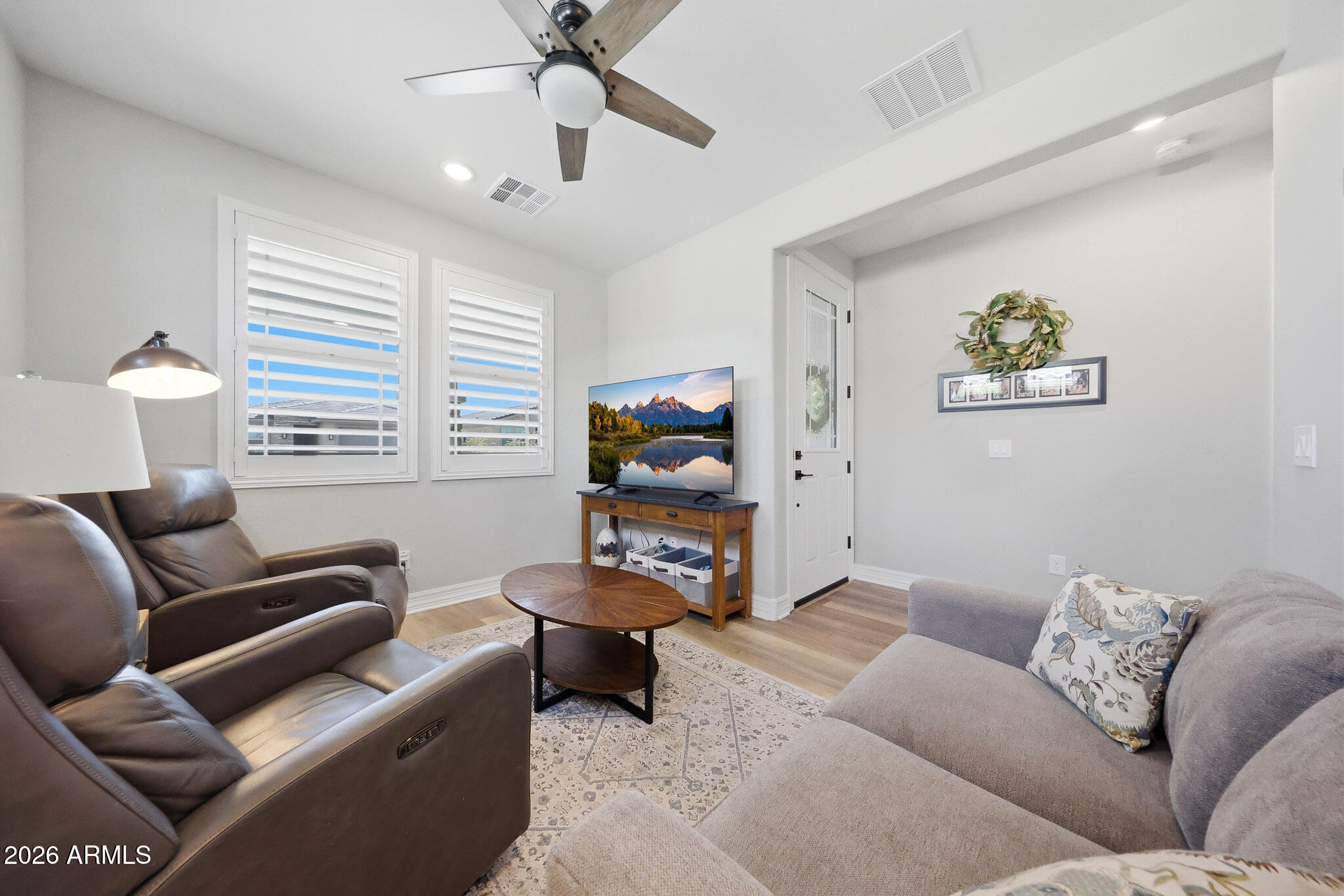 20636 West Luke Avenue Buckeye, AZ 85396 - Photo 3 of 42 a living room with furniture and a window