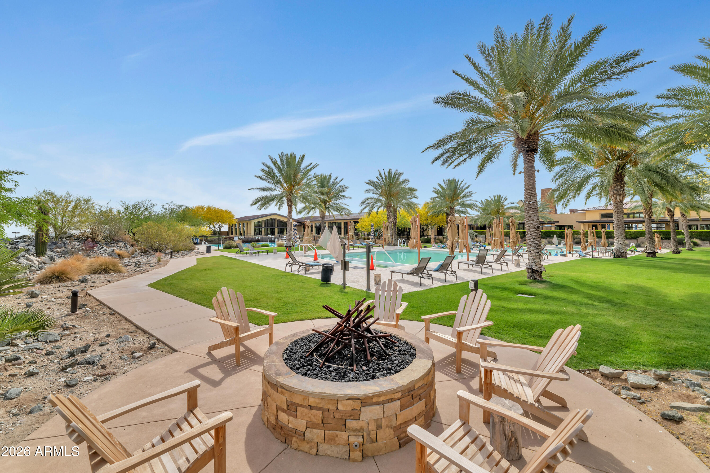 20636 West Luke Avenue Buckeye, AZ 85396 - Photo 39 of 42 a view of a swimming pool and lounge chairs