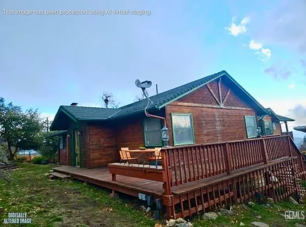 a view of a patio with table and chairs