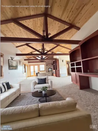 a bedroom with a large bed and a flat screen tv