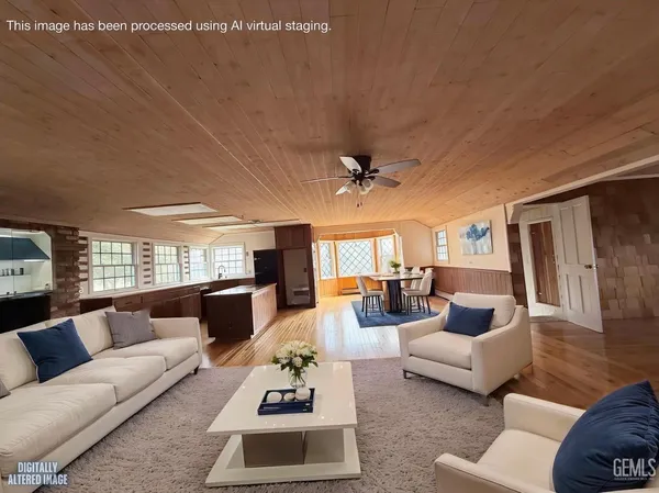 a view of a room with wooden walls