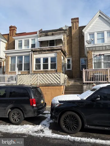 a view of a car parked in front of a house