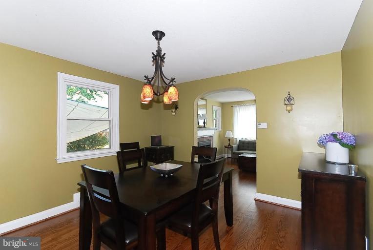 704 Charing Cross Road Baltimore, MD 21229 - Photo 7 of 20 a view of a dining room with furniture window and wooden floor