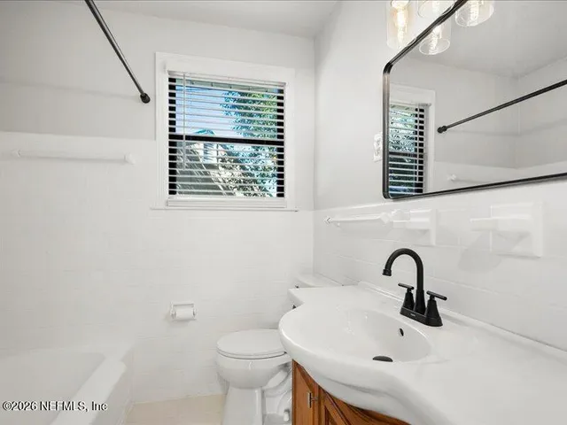 a bathroom with a sink and a toilet