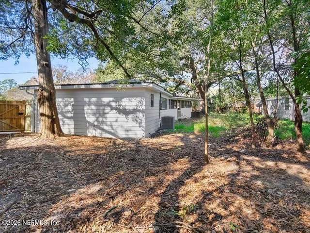 a backyard of a house with lots of green space