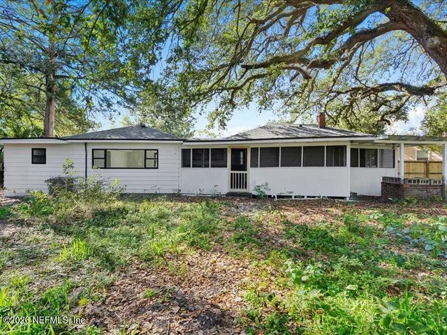 front view of a house with a garden