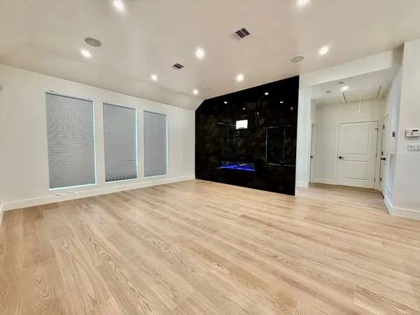 a kitchen with stainless steel appliances a refrigerator stove microwave and cabinets