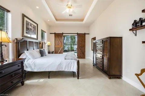 a bed room with a bed and a chandelier