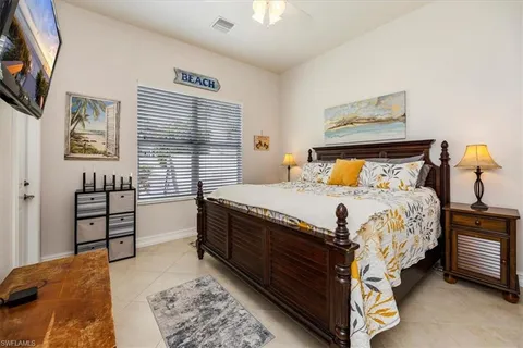 a bedroom with a bed and a tv in it