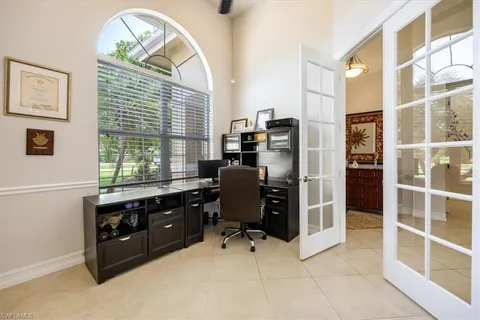 a view of workspace with wooden floor and windows