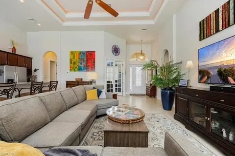 a living room with furniture fireplace and flat screen tv