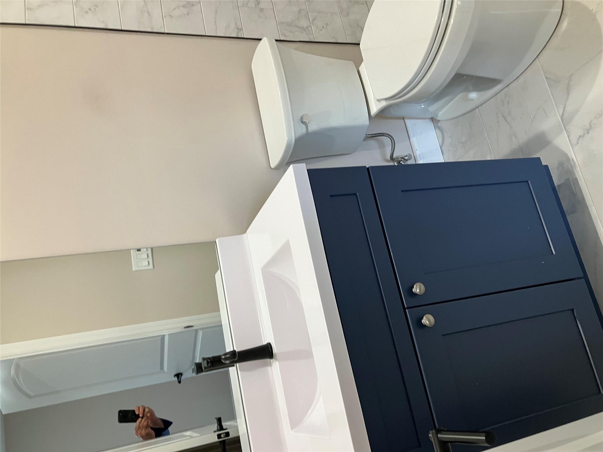 0 Mill Road Coram, NY 11727 - Photo 12 of 28 a bathroom with a sink and a toilet