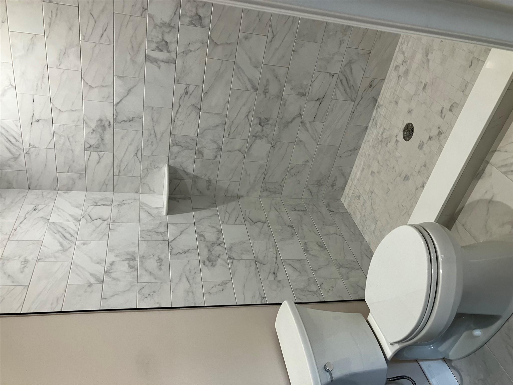 0 Mill Road Coram, NY 11727 - Photo 13 of 28 a bathroom with a toilet and a shower