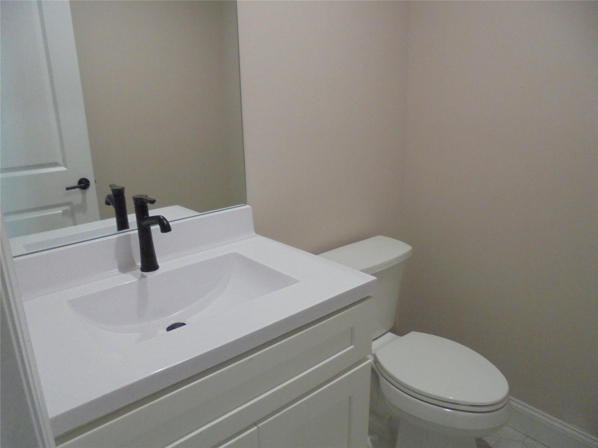 0 Mill Road Coram, NY 11727 - Photo 15 of 28 a bathroom with a sink a toilet
