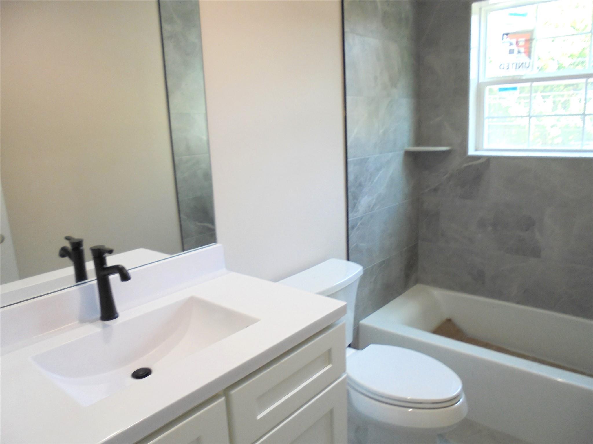 0 Mill Road Coram, NY 11727 - Photo 16 of 28 a bathroom with a sink a toilet and shower