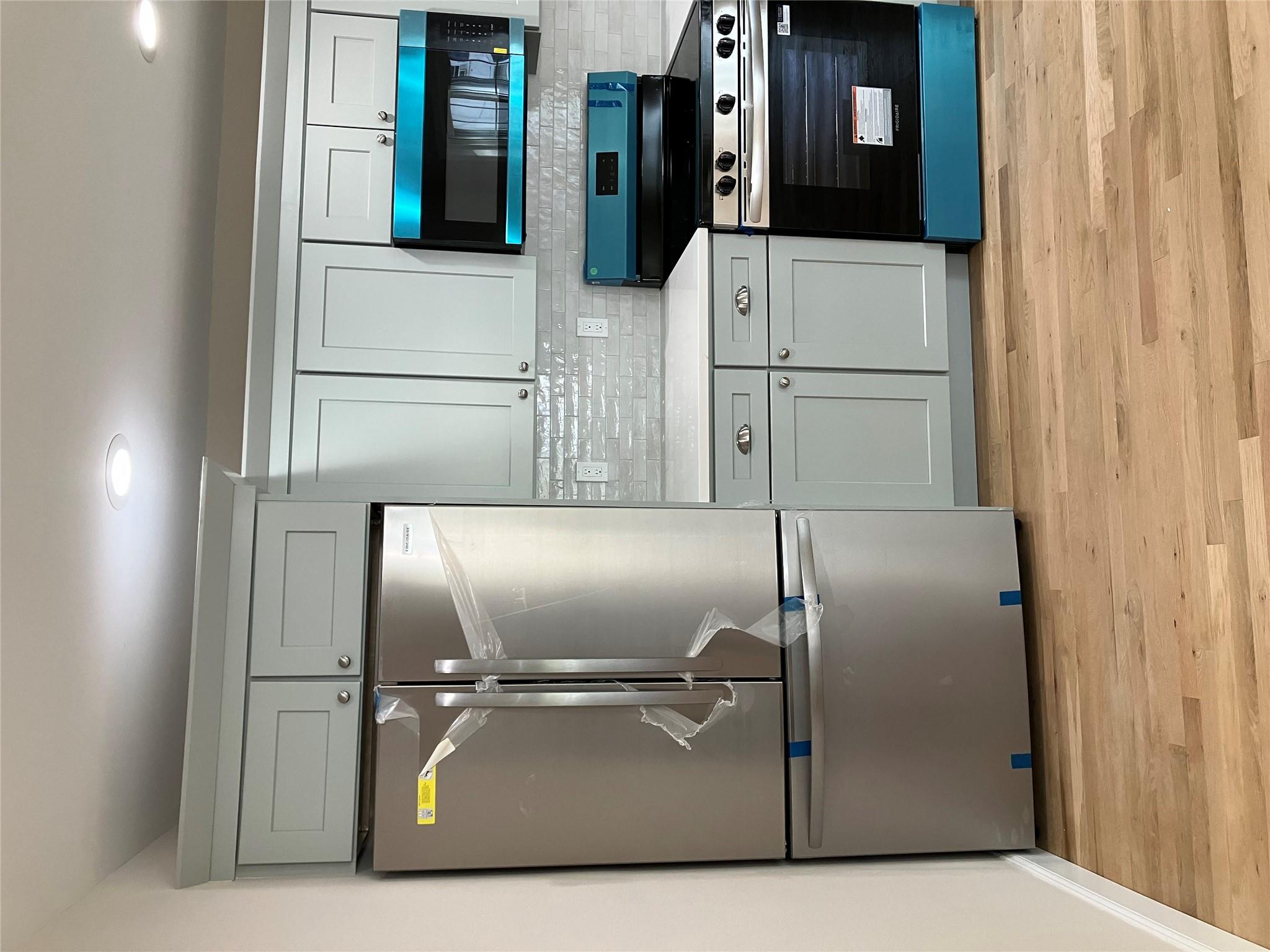 0 Mill Road Coram, NY 11727 - Photo 2 of 28 a kitchen with stainless steel appliances granite countertop a refrigerator and a stove top oven