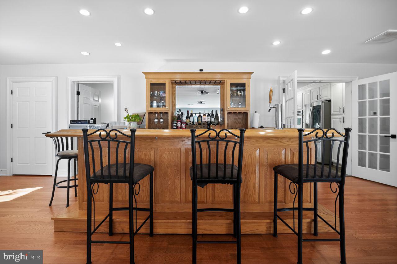 4304 Bridgeboro Road Moorestown, NJ 08057 - Photo 12 of 40 a view of a dining room with furniture and wooden floor