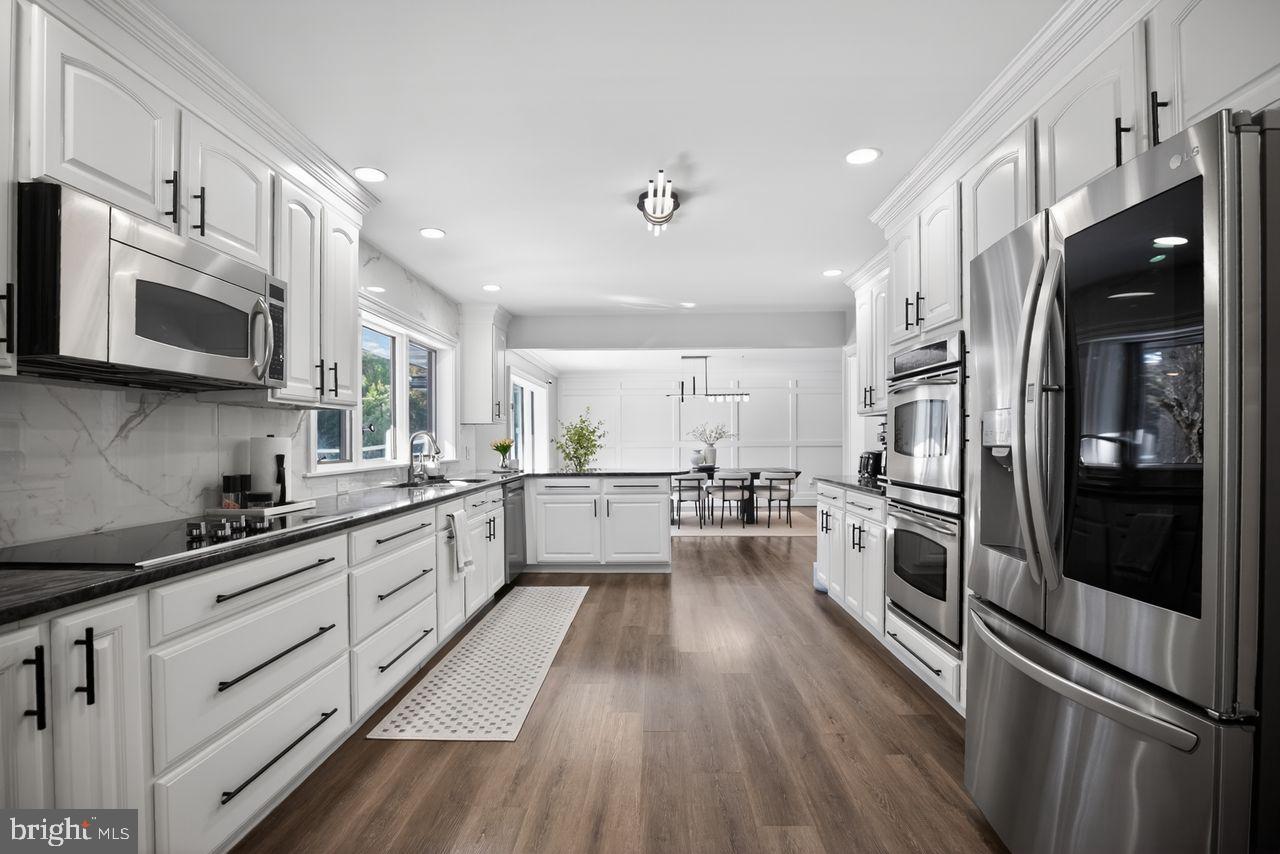 4304 Bridgeboro Road Moorestown, NJ 08057 - Photo 13 of 40 a kitchen with stainless steel appliances a refrigerator sink and microwave