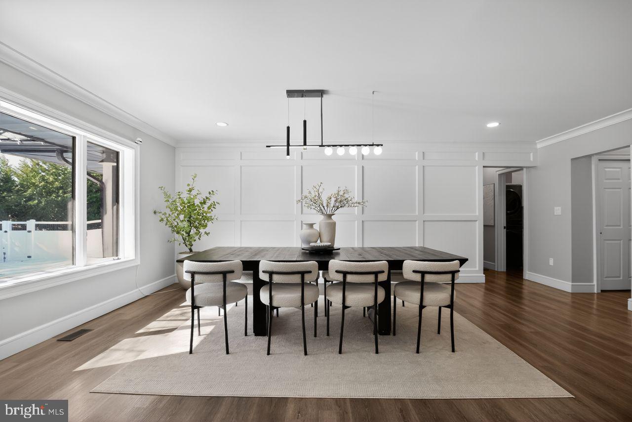 4304 Bridgeboro Road Moorestown, NJ 08057 - Photo 16 of 40 a dining room with furniture a rug and a potted plant