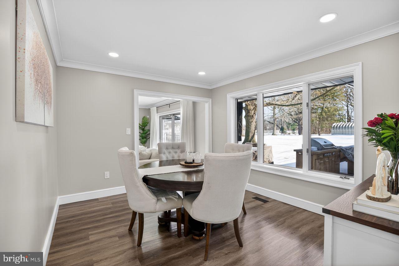 4304 Bridgeboro Road Moorestown, NJ 08057 - Photo 18 of 40 a view of a dining room with furniture window and wooden floor