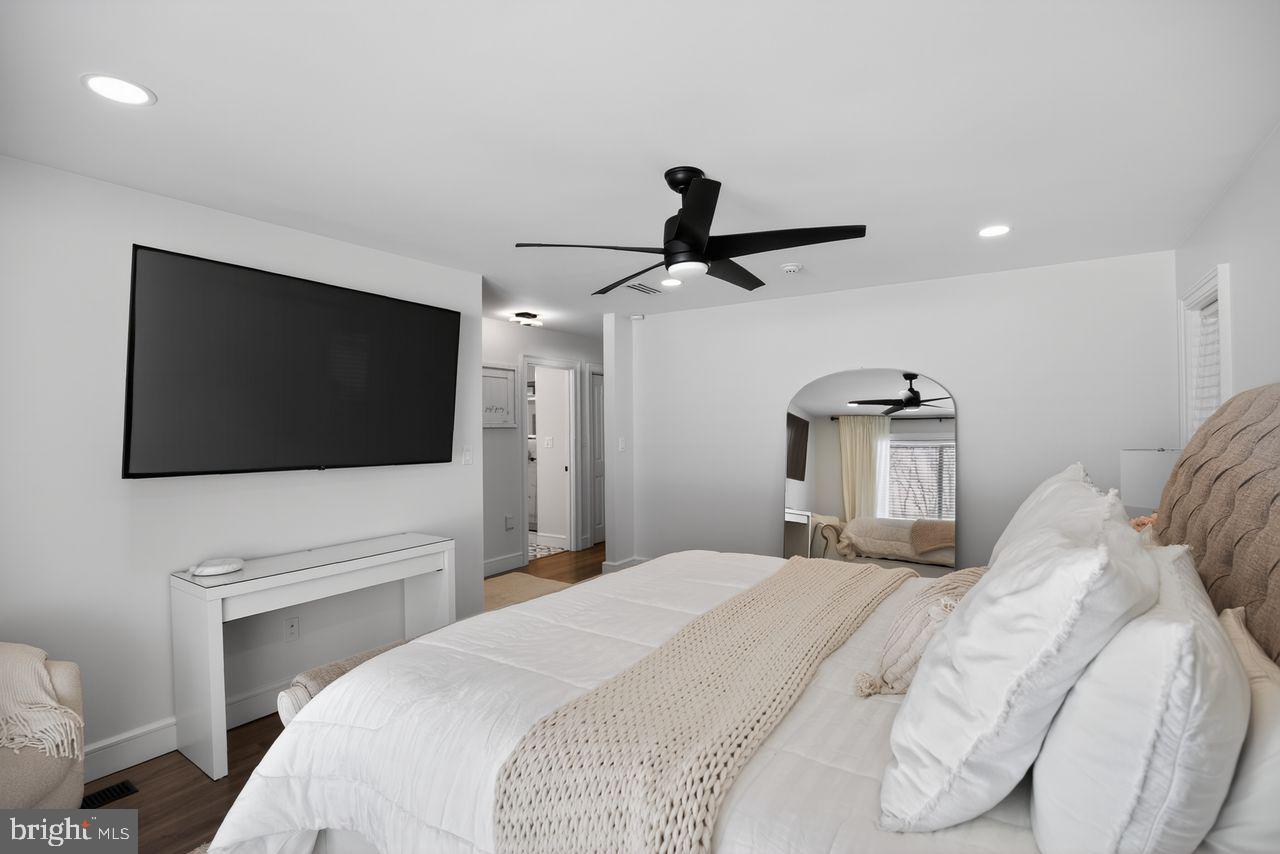 4304 Bridgeboro Road Moorestown, NJ 08057 - Photo 20 of 40 a bedroom with a large bed and a flat screen tv