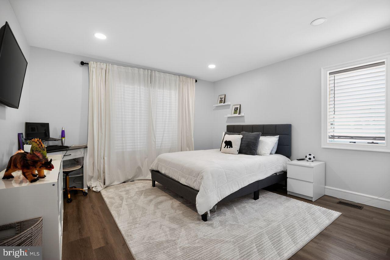 4304 Bridgeboro Road Moorestown, NJ 08057 - Photo 21 of 40 a bedroom with a bed and a flat tv screen on the dresser
