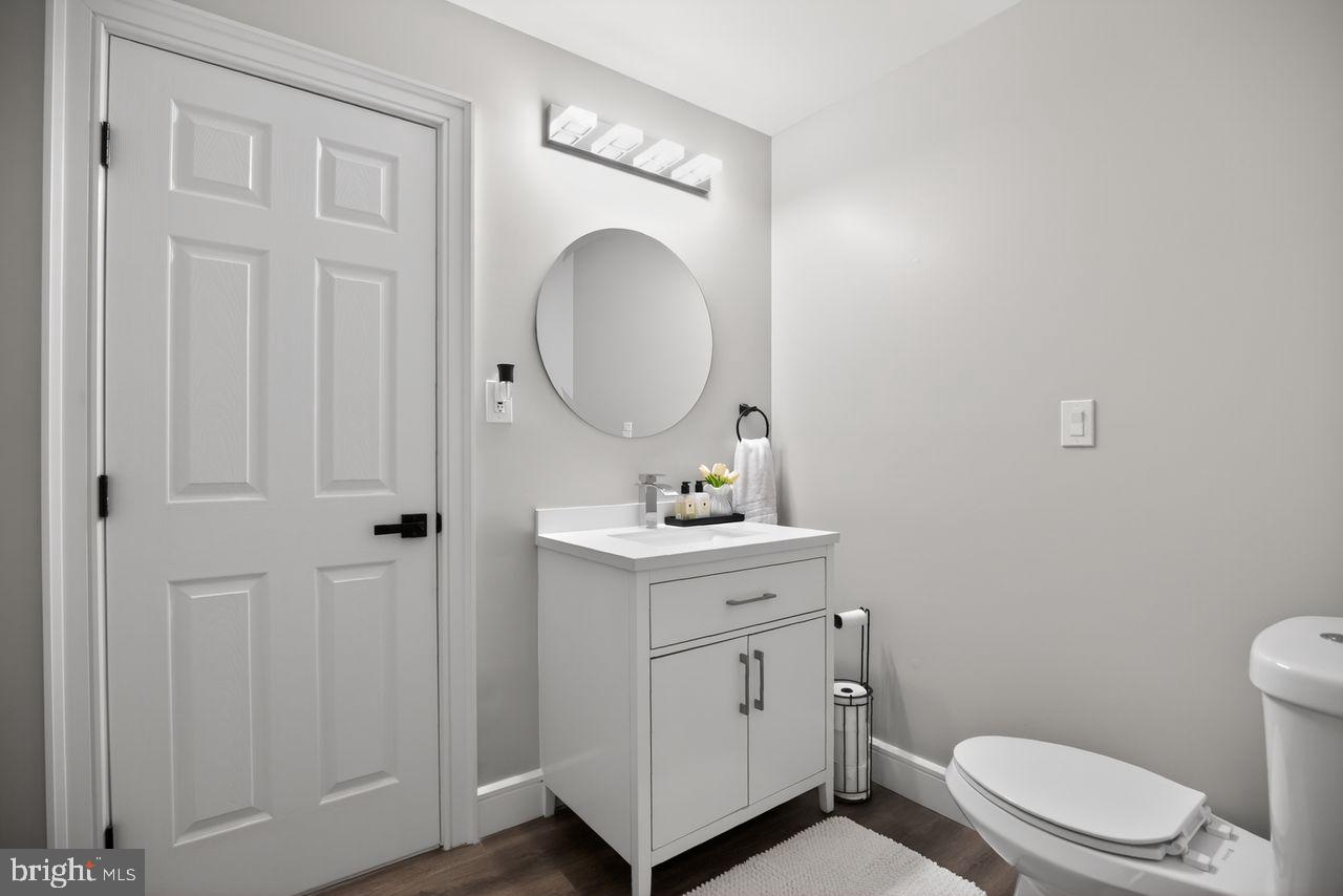 4304 Bridgeboro Road Moorestown, NJ 08057 - Photo 27 of 40 a bathroom with a toilet a sink and mirror