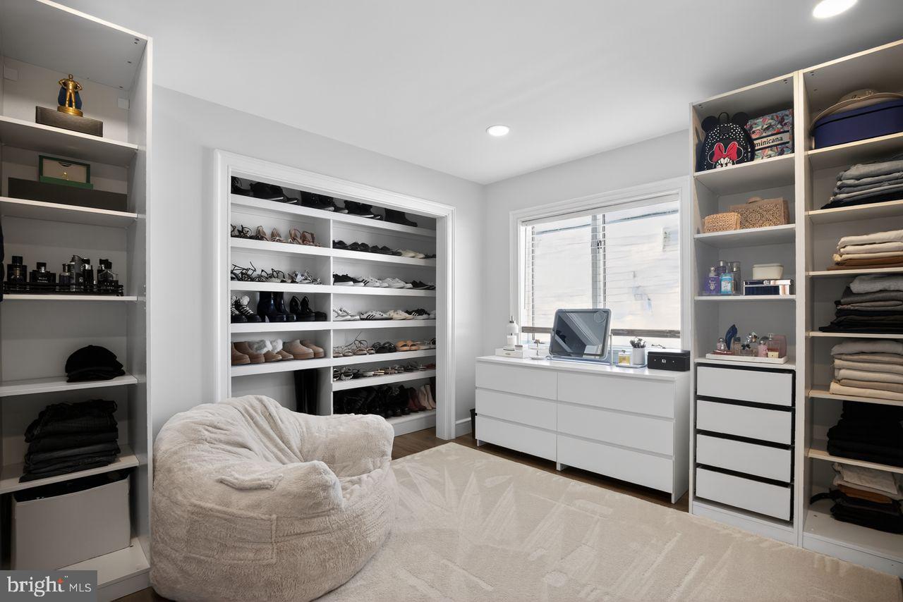 4304 Bridgeboro Road Moorestown, NJ 08057 - Photo 32 of 40 a living room with furniture cabinets and window