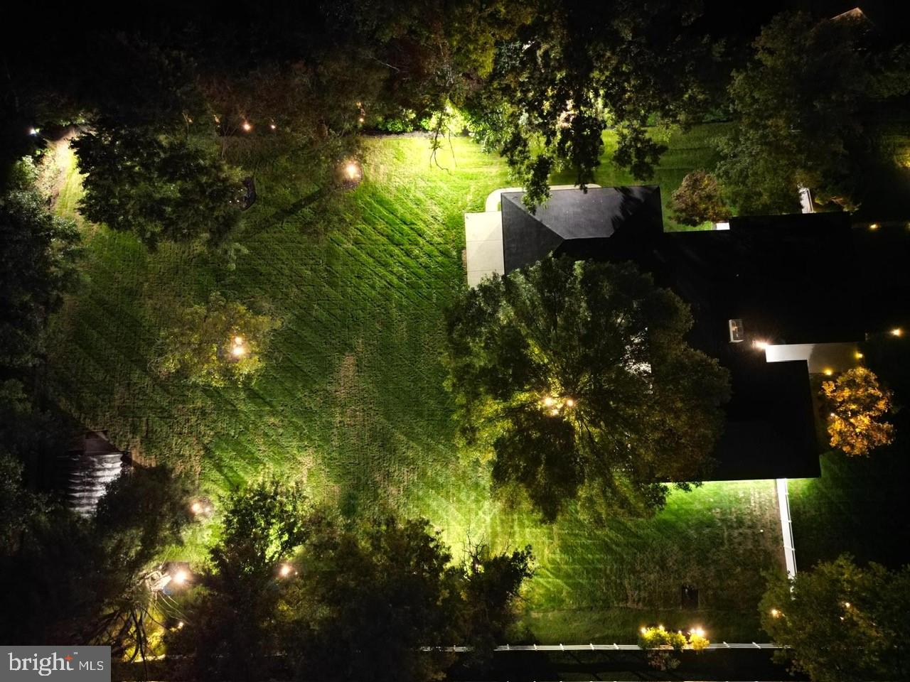 4304 Bridgeboro Road Moorestown, NJ 08057 - Photo 35 of 40 a backyard of a house with table and chairs and potted plants