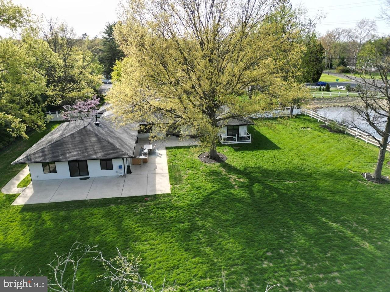 4304 Bridgeboro Road Moorestown, NJ 08057 - Photo 38 of 40 view of a house with a yard and a large tree