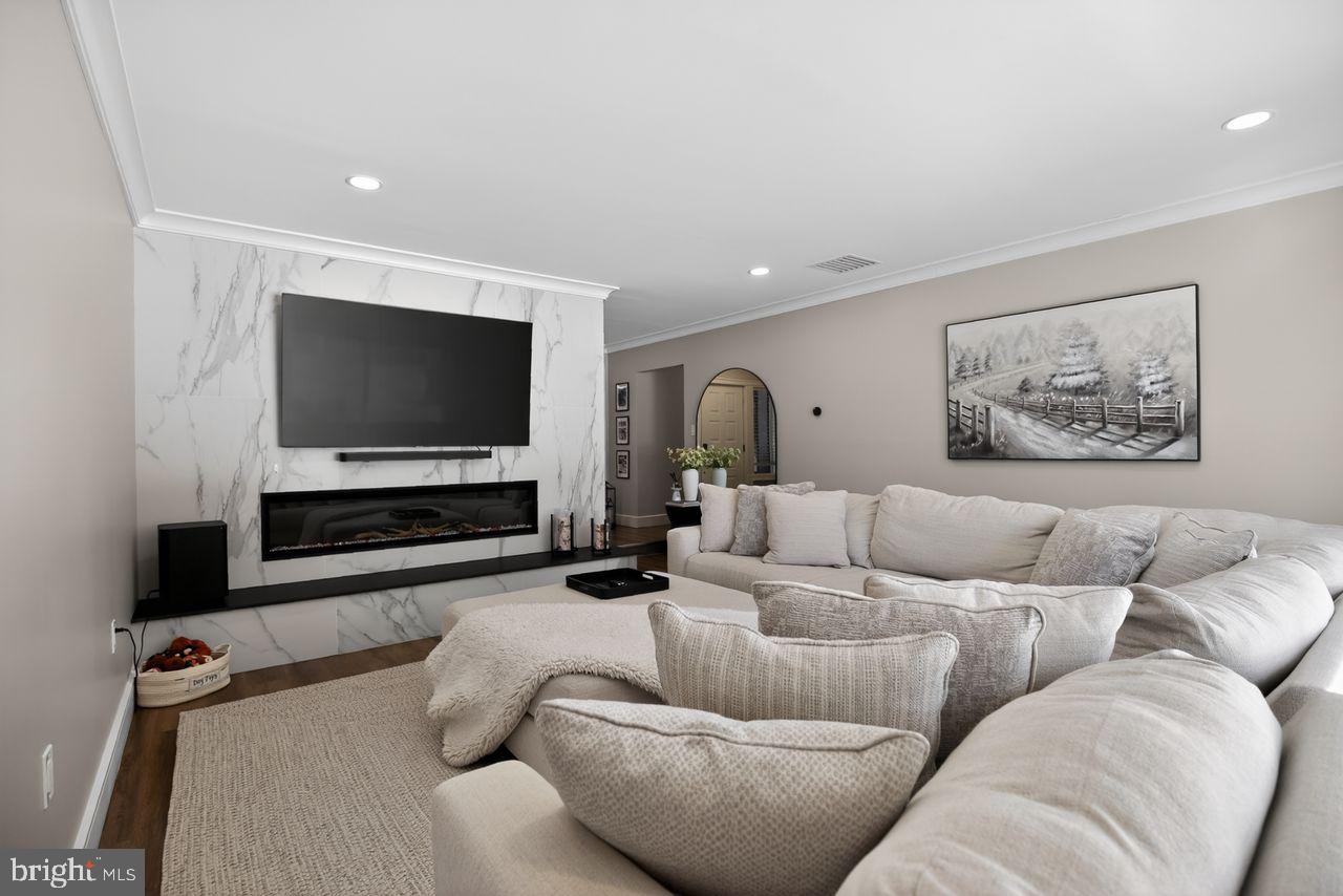 4304 Bridgeboro Road Moorestown, NJ 08057 - Photo 6 of 40 a living room with furniture and a flat screen tv