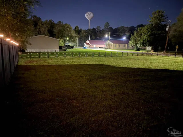 a view of a playground with green space