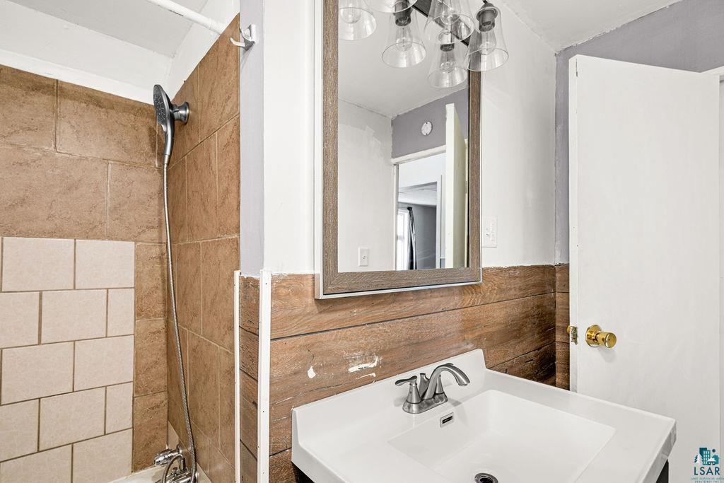 605 Weeks Avenue Superior, WI 54880 - Photo 11 of 21 Bathroom featuring vanity and shower / bathtub combination
