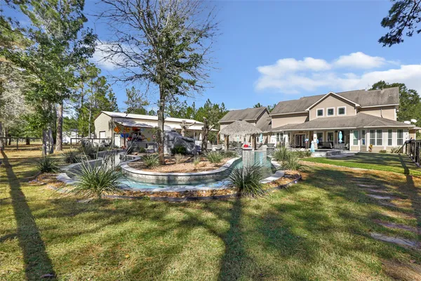 a view of a swimming pool with a house in the background