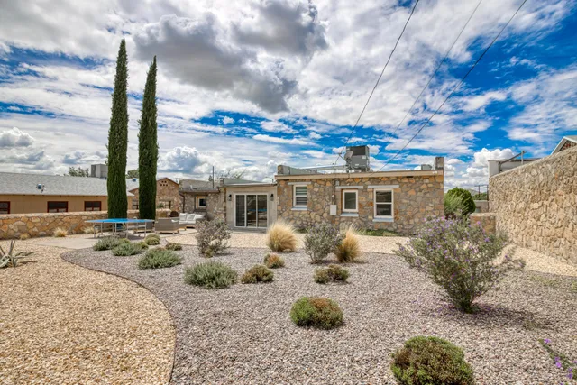 a front view of house with yard and seating space