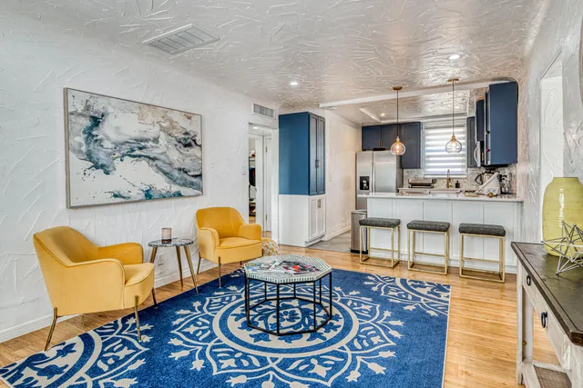 a living room with furniture and a rug