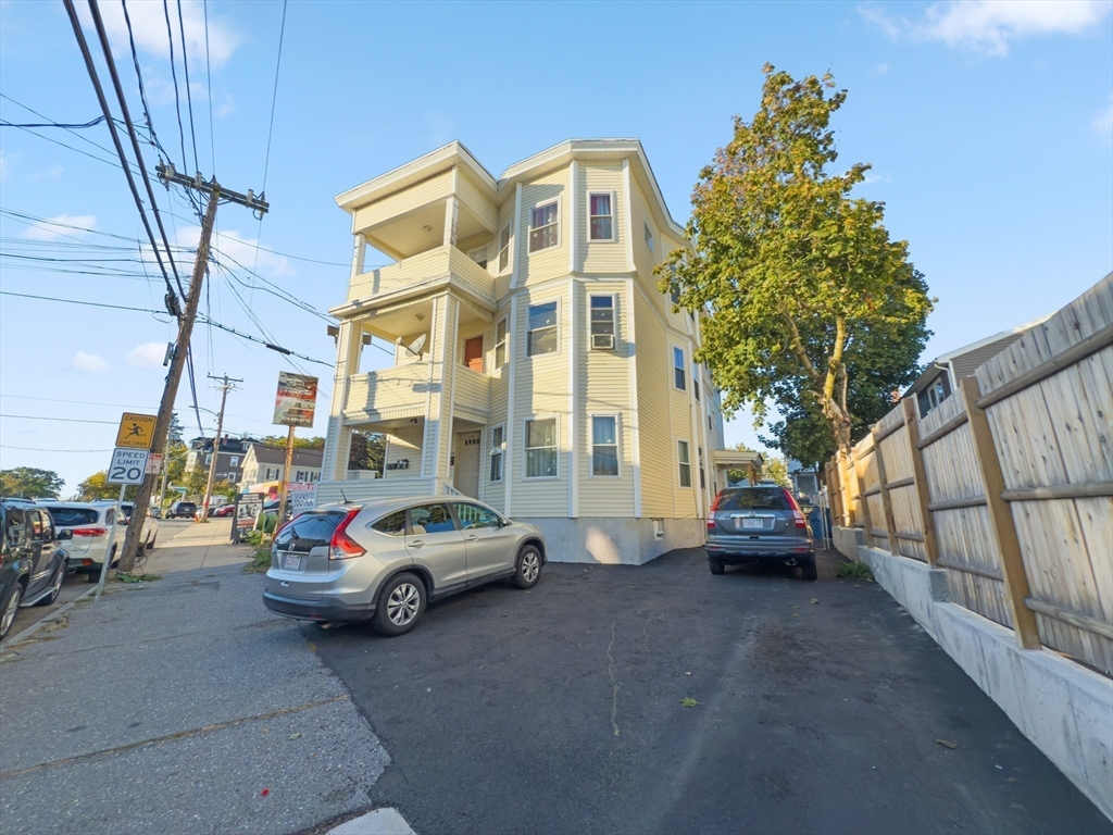 339-341 Lawrence Street Lawrence, MA 01841 - Photo 17 of 20 a car parked in front of a building