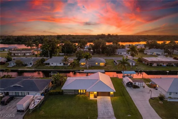 an aerial view of a houses with yard