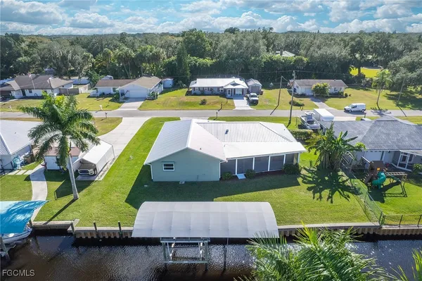 an aerial view of a house with a ocean view