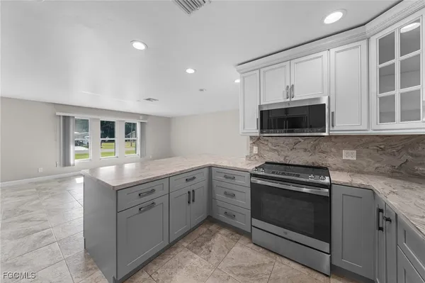 a view of kitchen and kitchen with sink