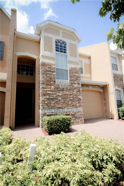 522 Terrace Spring Drive, Unit 522 Orlando, FL 32828 - Photo 1 of 1 a view of a front of house with a yard